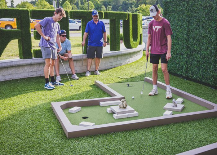 A stroll through Drive Shack's mini golf course reveals Puttery's whimsical outdoor art garden, where each hole is a masterpiece.
